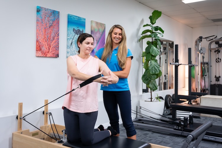 Patient doing exercise rehabilitation as part of their shoulder physio appointment