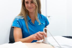 Carleen doing an ultrasound during a women's health physio appointment