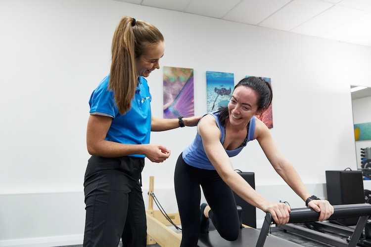 Woman doing an exercise for return to sport after life changes