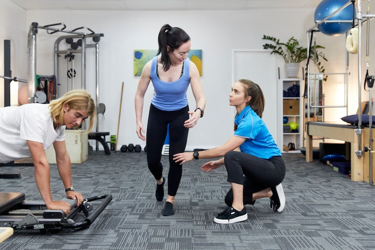 Wide shot of multiple people doing the womens resistance training program